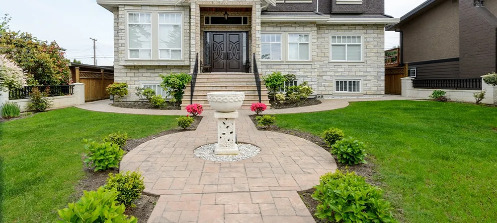 small waterfall fountain in front of home