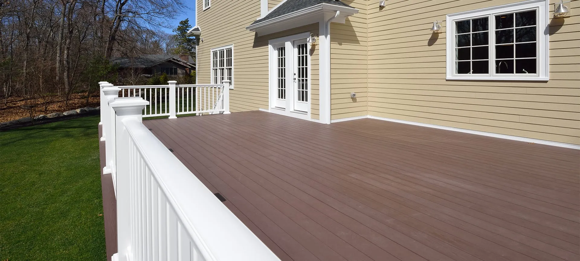 wooden deck with with fence in lawn