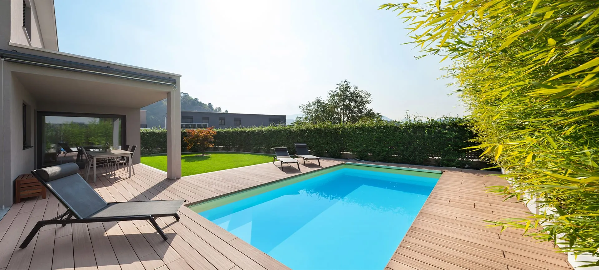 fibreglass pool in backyard with wooden decking