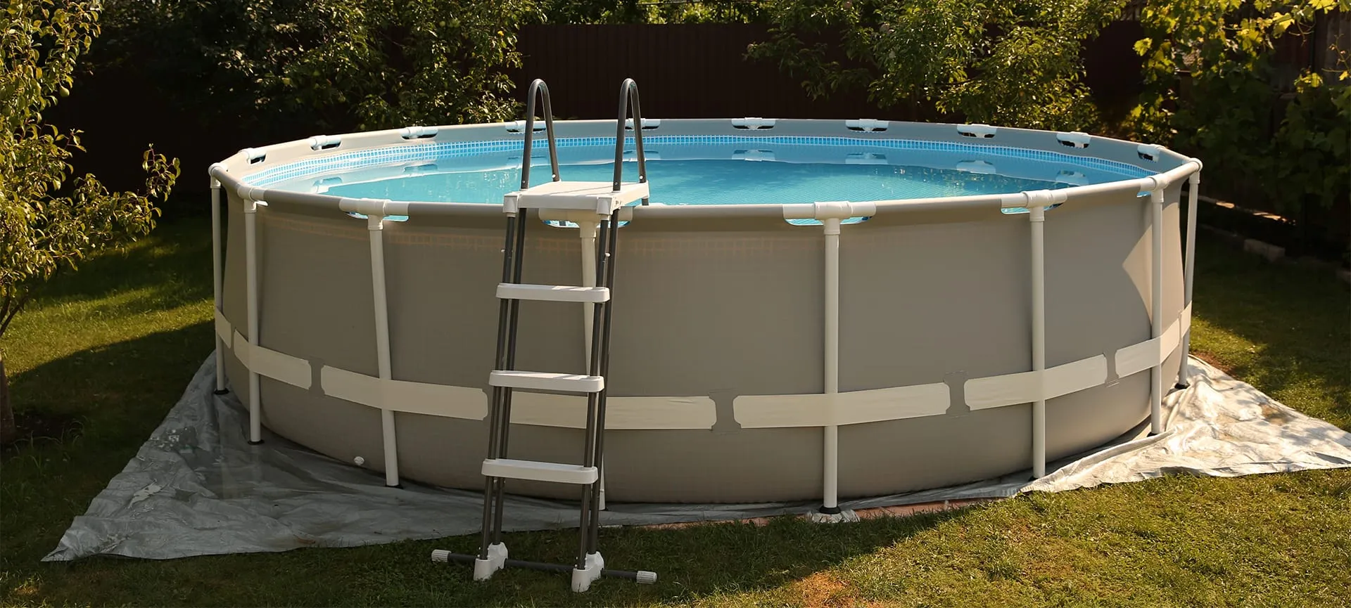 Above ground swimming pool outdoors on sunny day