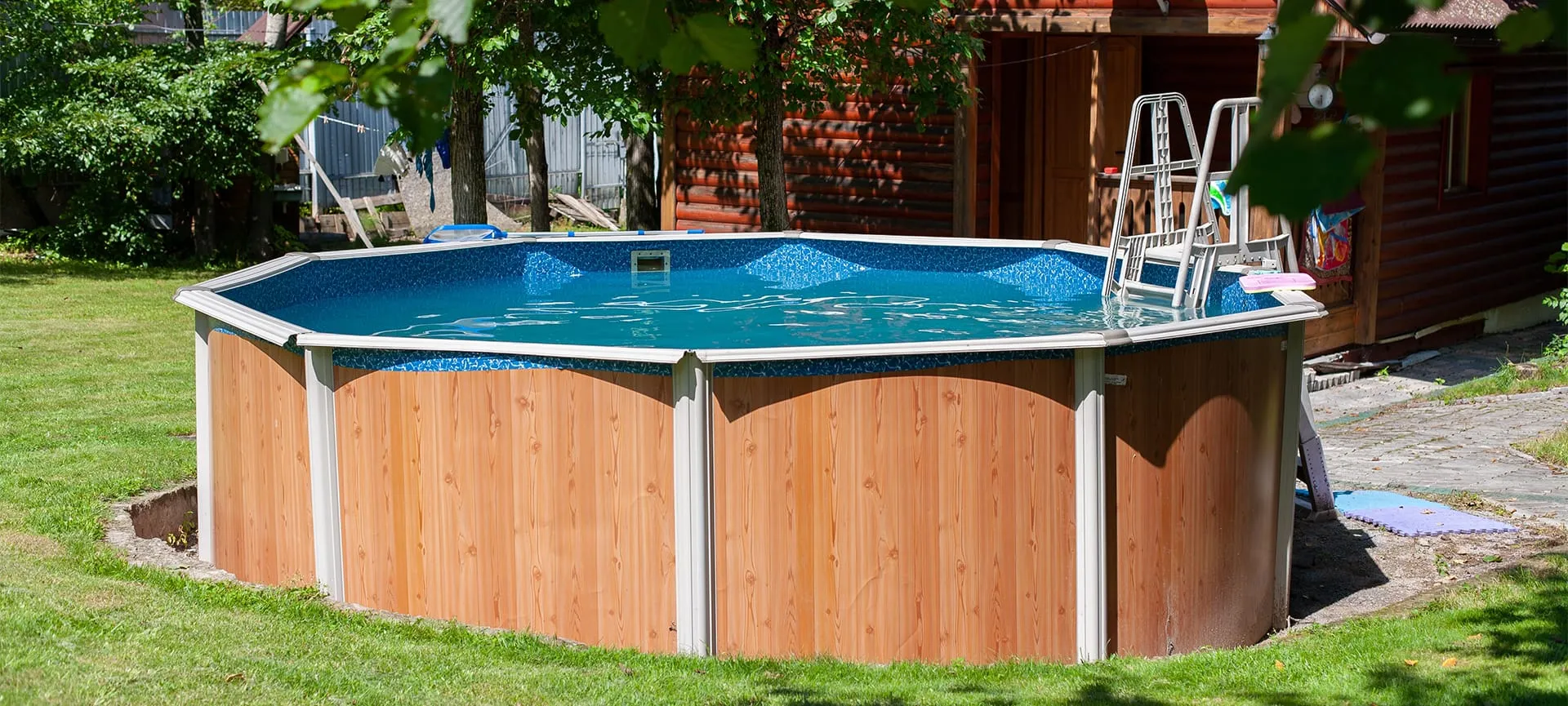 above ground swimming pool in backyard