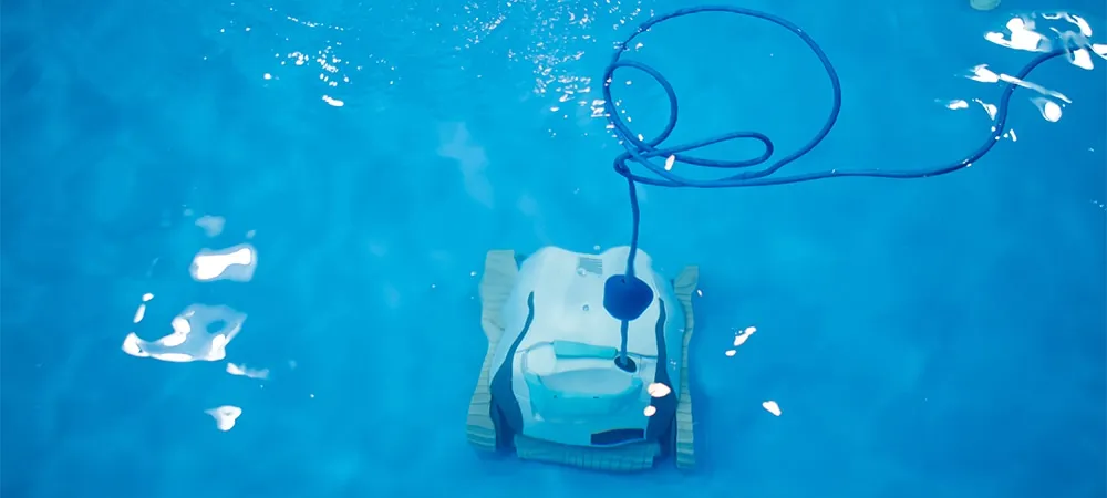 automatic robotic pool cleaner is cleaning the pool