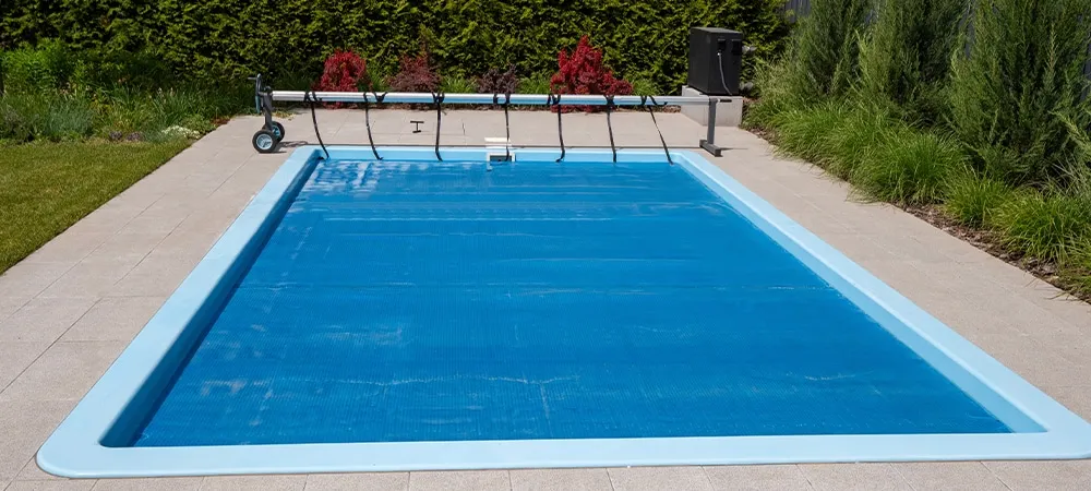 pool automatic cover with deck and landscaping