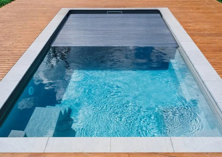 automatic pool cover with wooden deck