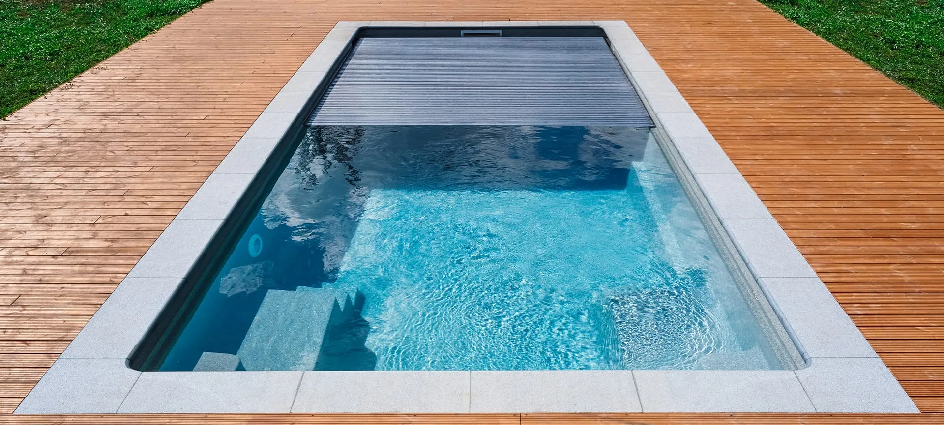 automatic pool cover with wooden deck