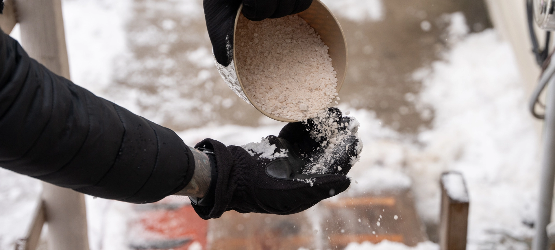 rock salt ice melt is being spread on your walkway to melt the ice and snow from your path