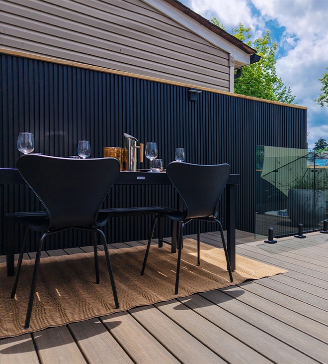 chairs and table with fence on backyard chairs and table with fence on backyard