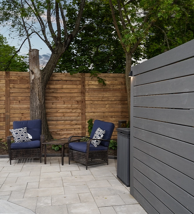 chairs on interlocking patio with privacy screen