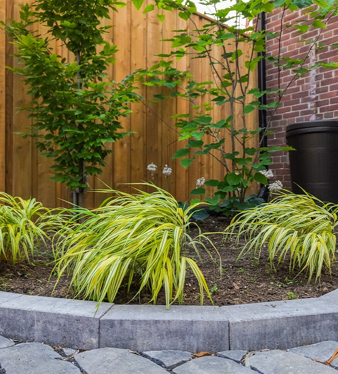 concrete retaining wall for landscaping and wooden fence