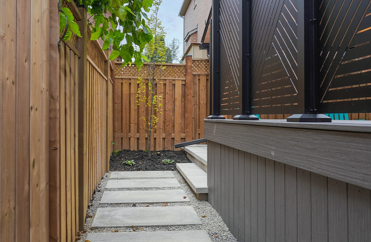 concrete steps walk way behind privacy screen
