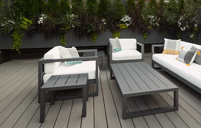 new stylish composite decking and sitting setup wooden chairs coach table