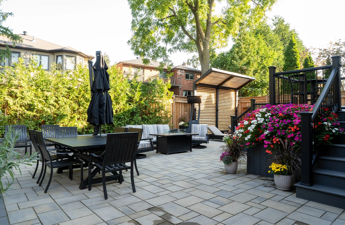 open backyard, sitting setup, flowers decor, privacy screen, fence, interlocking floor