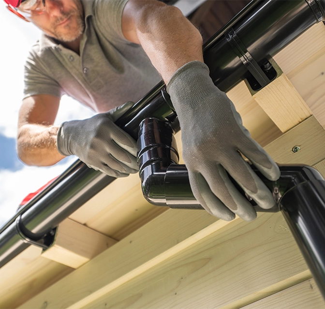 professional man installing eavestrough