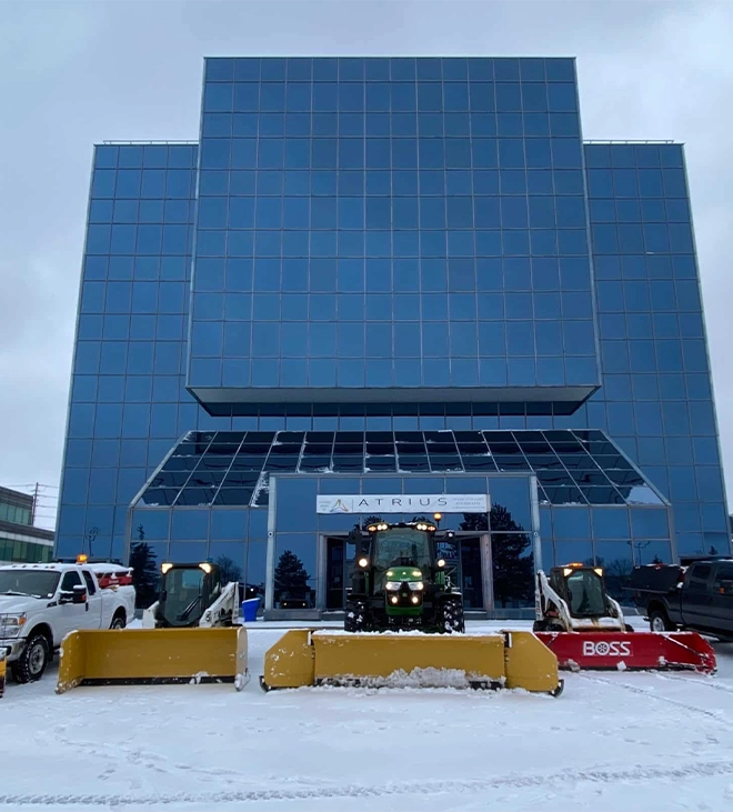 snow removing equipment in front of building