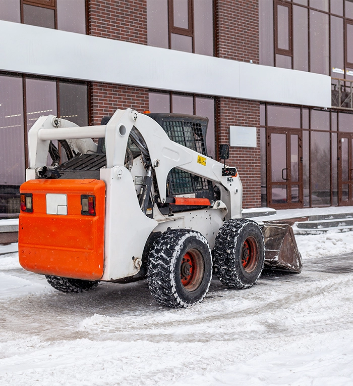 snow removing truck in front of office
