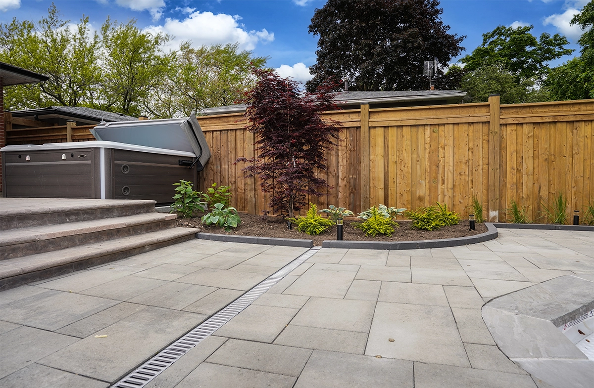 water drainage system on interlocking floor and landscaping