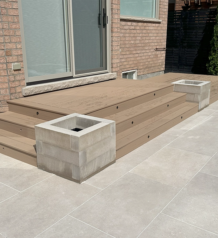 wooden deck and steps with paver floor