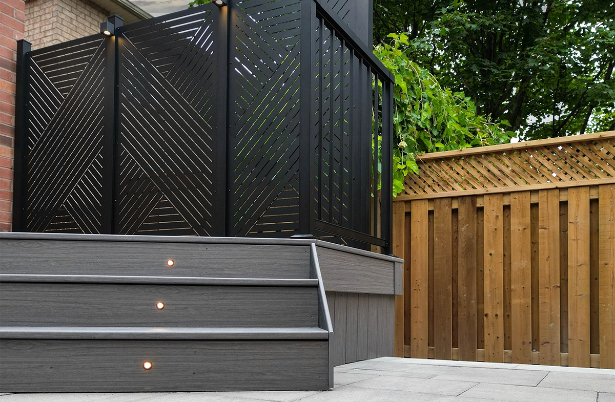 wooden stairs with privacy screen and fence