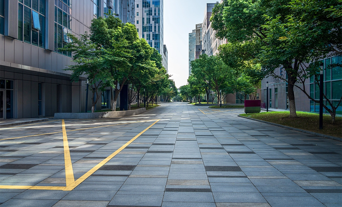asphalt paving commercial road between buildings