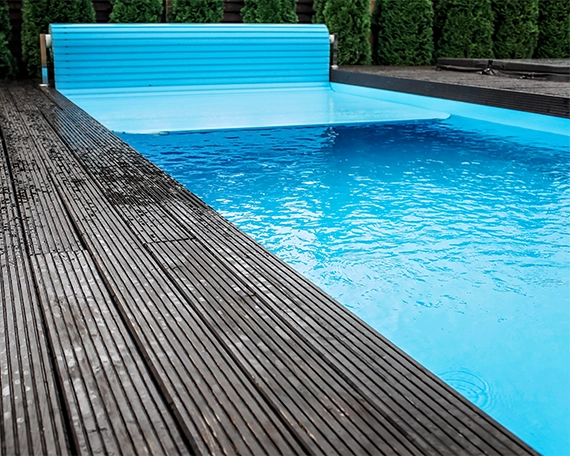 automatic pool cover image one automatic pool cover on pool with trex deck