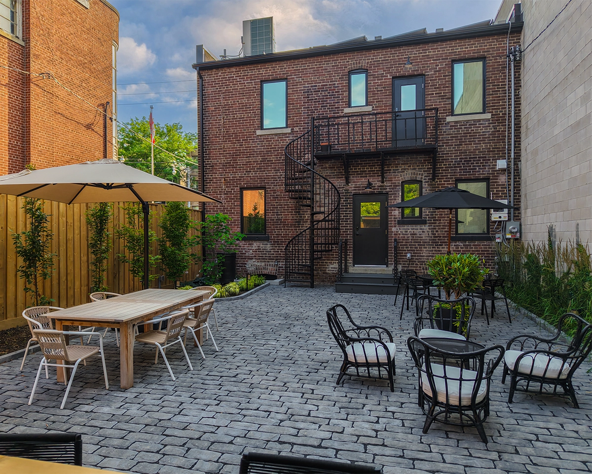 landscaping with fence in sitting area, front home bricks wall design