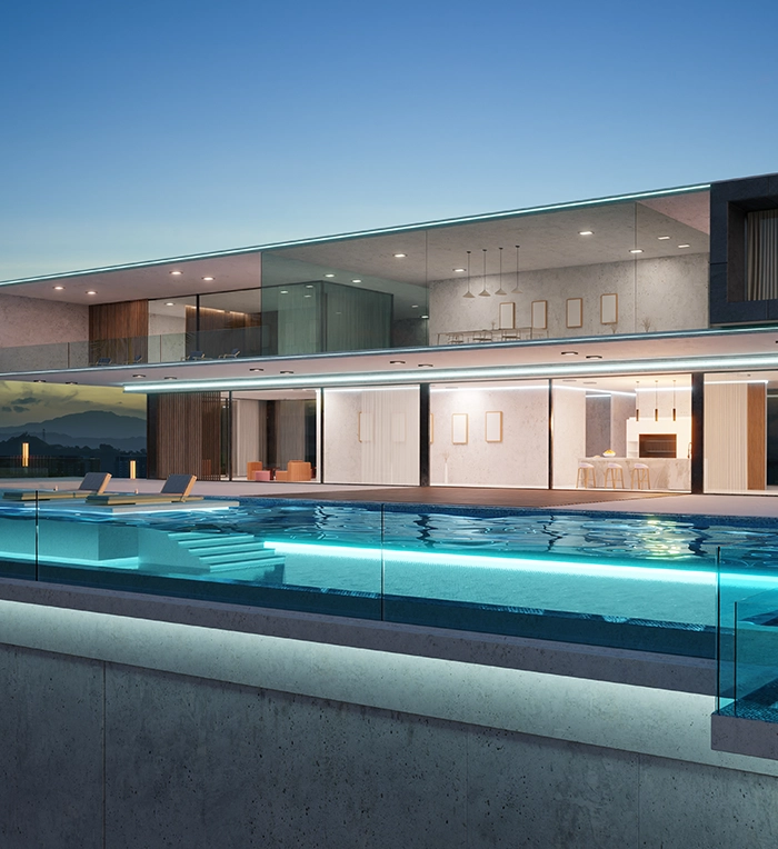 lighting in acrylic and glass walled pool, pool space covered with glass, in front of luxury home, large glass walls