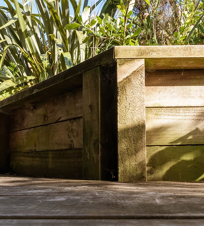 close up corner view of wooden retaining wall close up corner view of wooden retaining wall