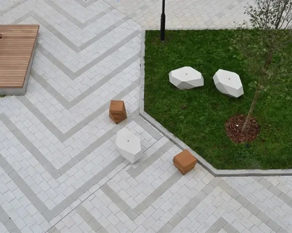 top view of commercial paving surface with sodding and mulch