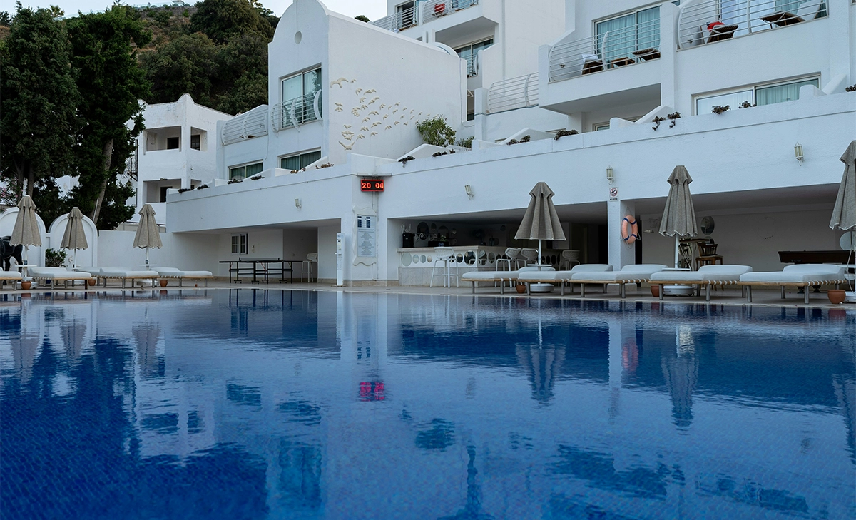 commercial swimming pool in front of hotel building