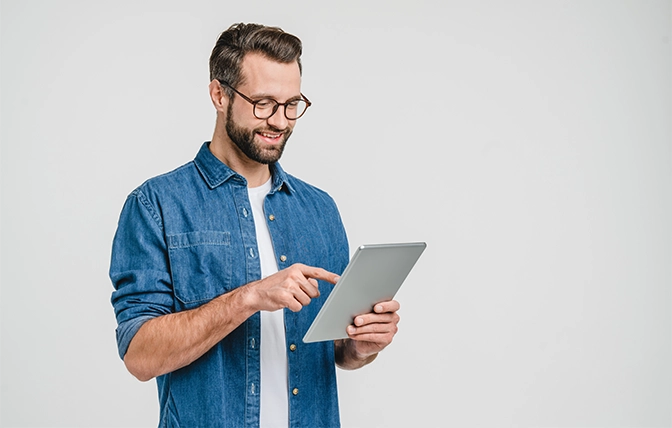 smiling man hold tablet in his hand