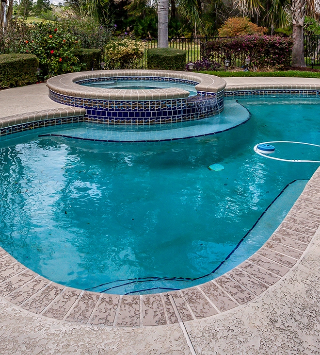 custom design concrete pool toward garden, pool cleaning process
