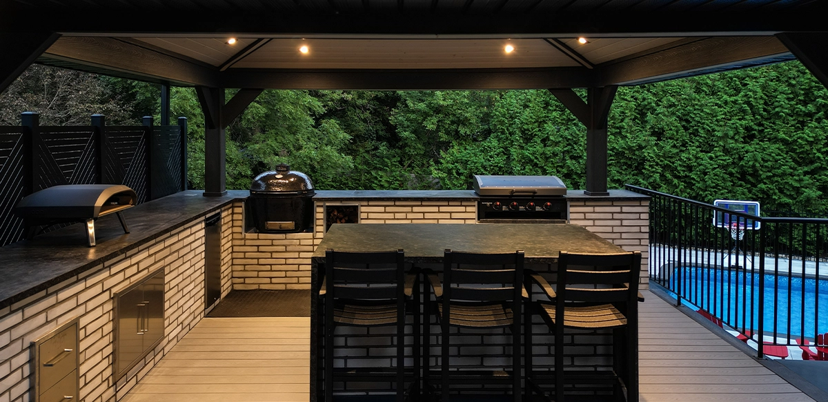 open kitchen with dinning setup under patio cover