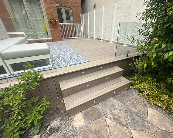 deck gallery image one deck and lighting feature on step with glass railing