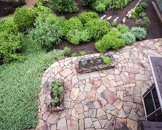 top view of flagstone patio beside home