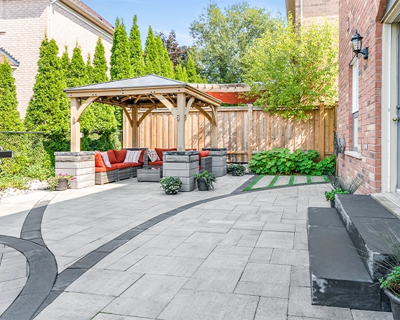 gazebo in home backyard with interlocking floor