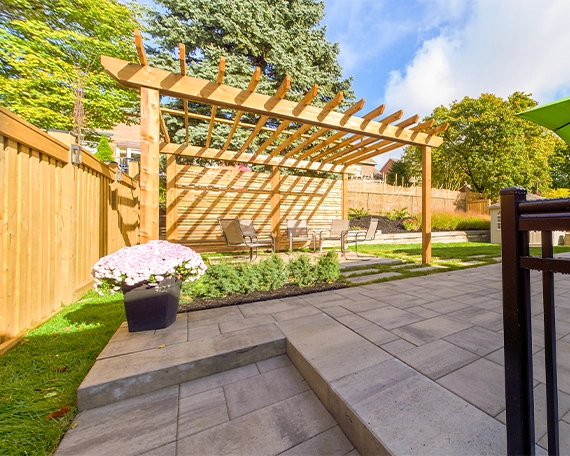 hardscaping image seven custom cabana with fence on yard and interlocking surface