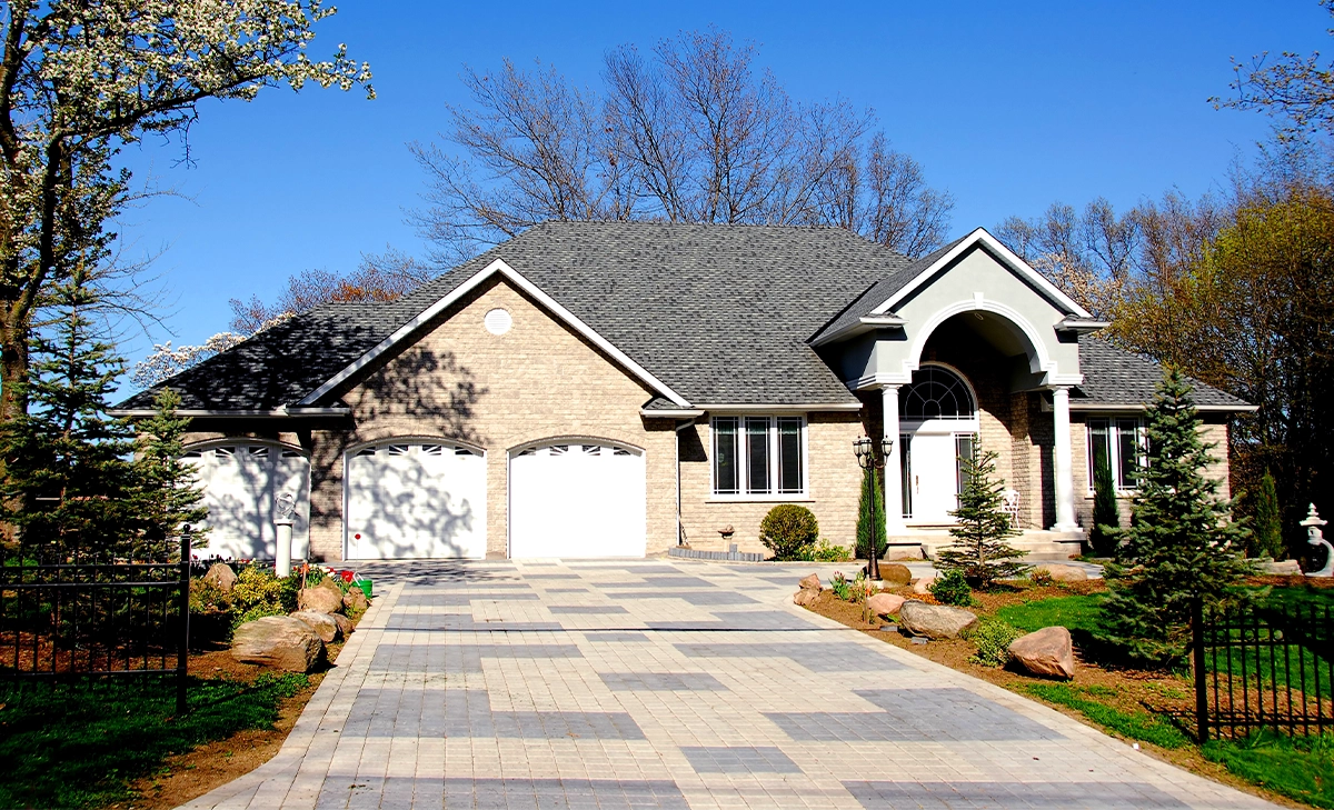 large home front with garage and interlock driveway