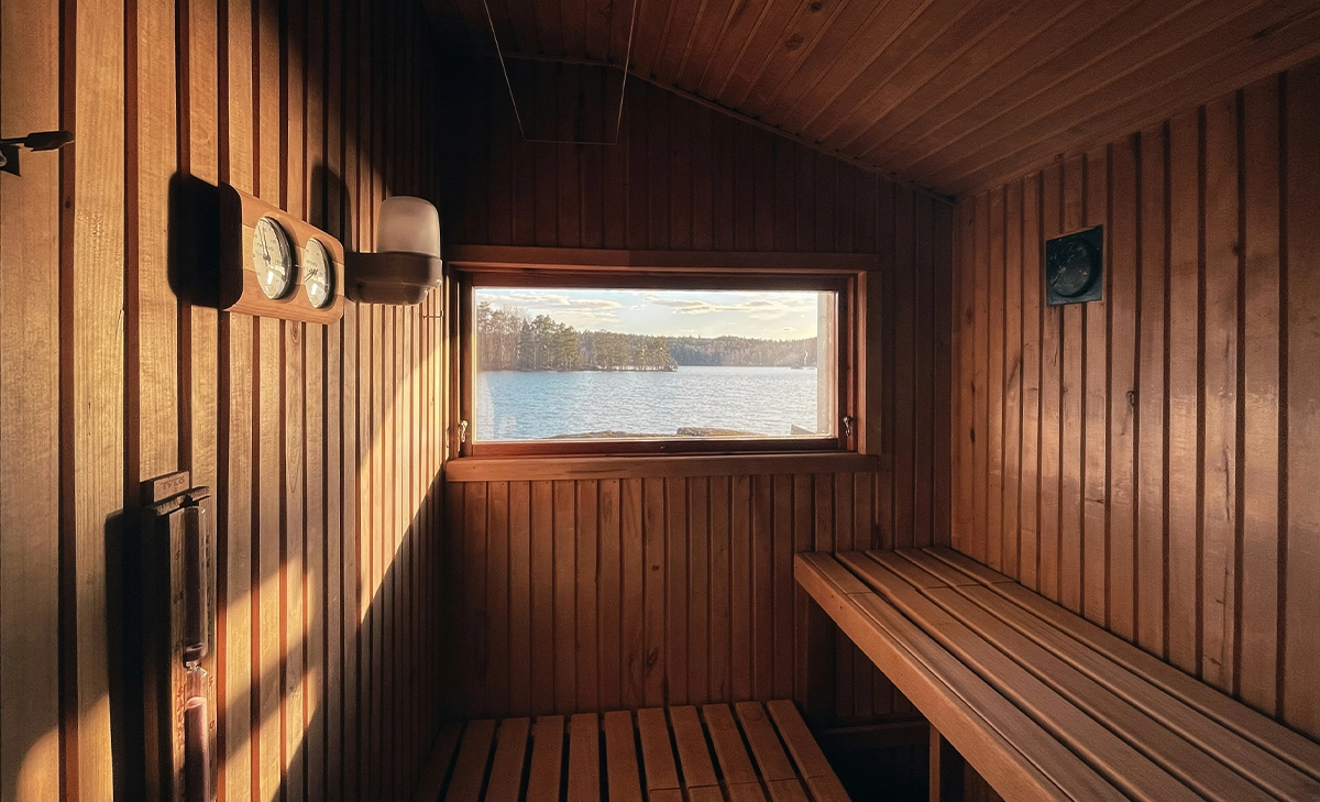 outdoor sauna inside view, sea view from window, sunlight coming inside from window