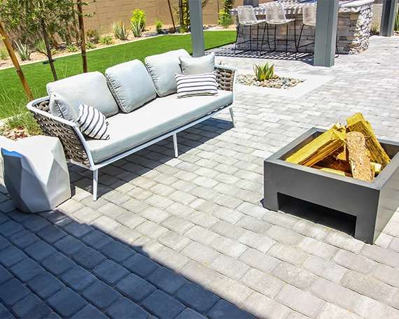 interlock patio image one coach in front of fire pit in interlock patio