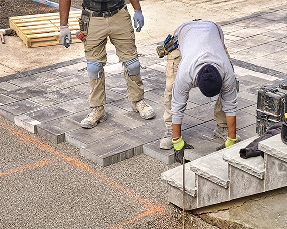 professional man installing interlock blocks