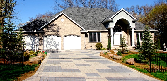 interlocking driveway in front of home garage