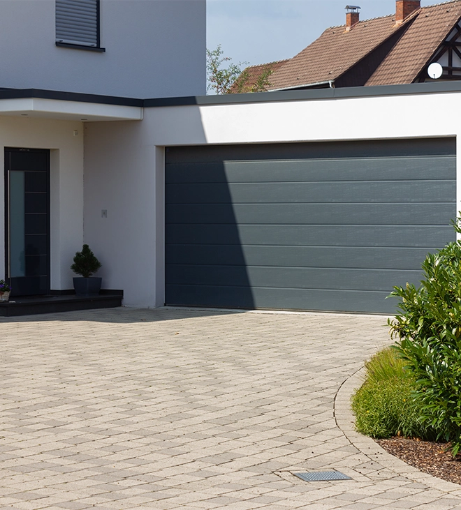 interlocking driveway in front of home door and garage