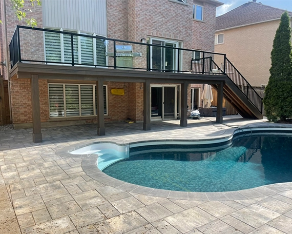 pool interlocking deck and coping in backyard