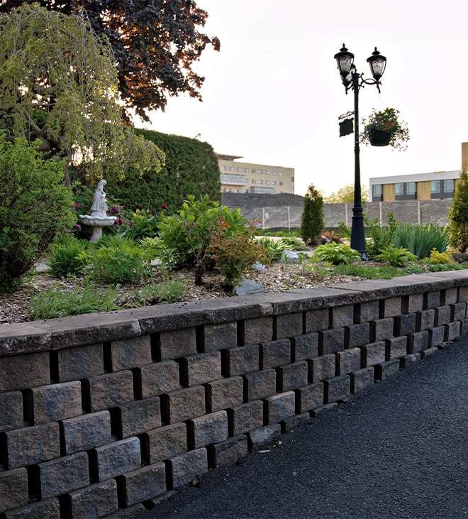 interlocking block retaining wall across road side