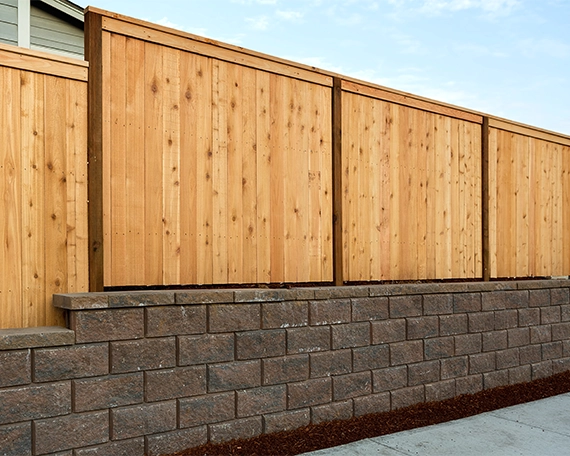 interlocking blocks retaining wall and wooden fence