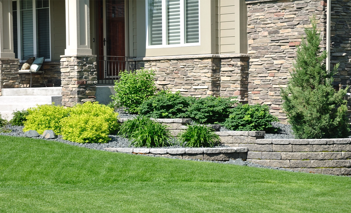 interlocking blocks retaining wall hold back soil in home front yard