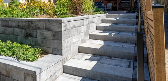 interlock steps and retaining walls, home front entrance, beside wooden fence