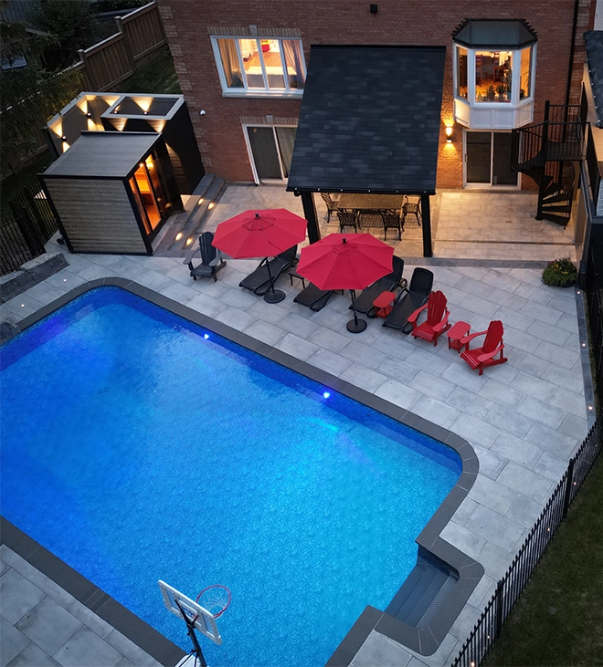 luxury backyard, interlocking surface around pool, sitting setup and cabanas