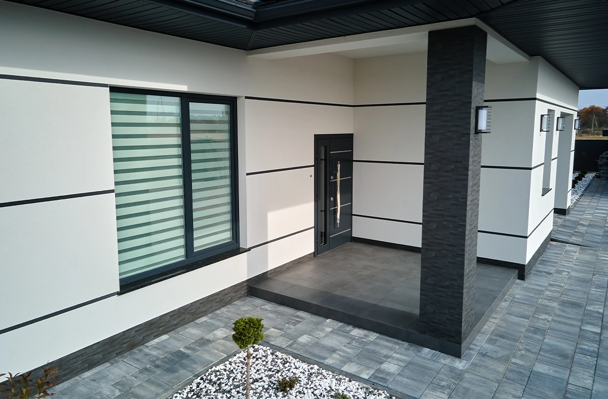 modern home front porch, pillar interlocking floor, modern door and window, complete home corner front view