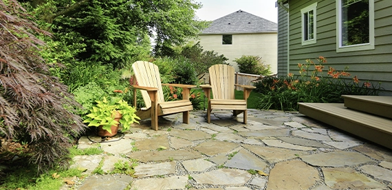 natural stone patio in home backyard